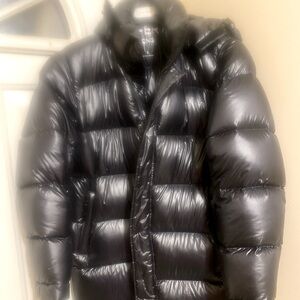 The Aritzia Super Puff Long - Hi-Gloss in black